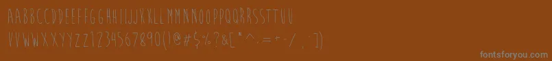 フォントBrainFlowerEuro – 茶色の背景に灰色の文字