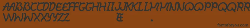 Ibayo Font – Black Fonts on Brown Background