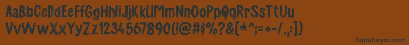Шрифт Charmeladedemo – чёрные шрифты на коричневом фоне