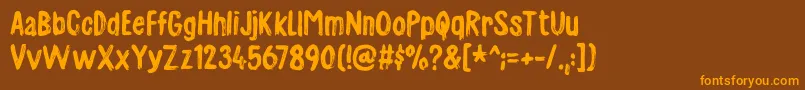 フォントCharmeladedemo – オレンジ色の文字が茶色の背景にあります。