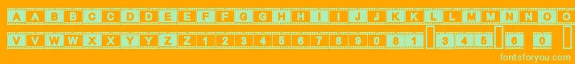 Acfilmstrip-Schriftart – Grüne Schriften auf orangefarbenem Hintergrund