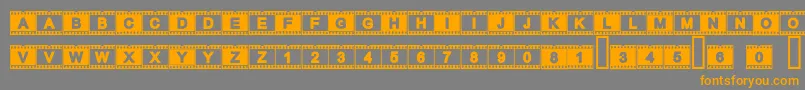 フォントAcfilmstrip – オレンジの文字は灰色の背景にあります。