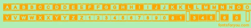 フォントAcfilmstrip – オレンジの文字が緑の背景にあります。