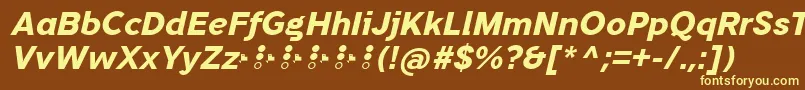 TripletaExtraboldItalic-fontti – keltaiset fontit ruskealla taustalla