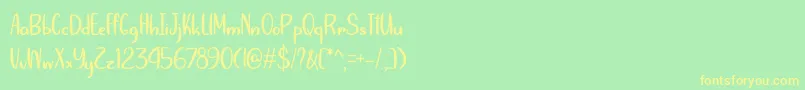 フォントSummersVictoryOverSpringOtf – 黄色の文字が緑の背景にあります