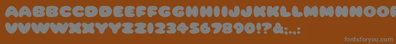 HffCottonBalls-Schriftart – Graue Schriften auf braunem Hintergrund