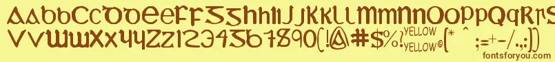 フォントUncialMostIrish – 茶色の文字が黄色の背景にあります。