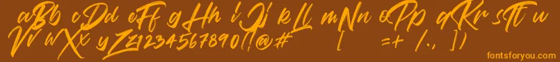 VaughanHandstylishfontDemo-fontti – oranssit fontit ruskealla taustalla