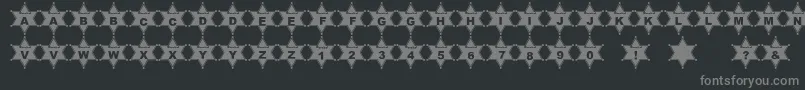 PfMarshalDOrr-fontti – harmaat kirjasimet mustalla taustalla