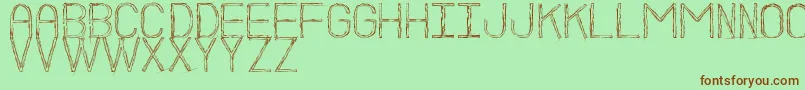 BocetoSt Font – Brown Fonts on Green Background