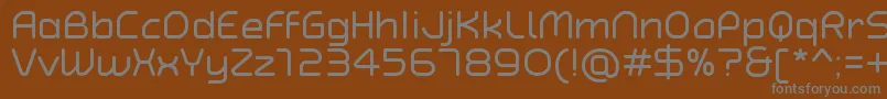 TypoAngularRoundedRegularDemo-fontti – harmaat kirjasimet ruskealla taustalla