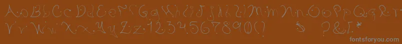 Pystil Font – Gray Fonts on Brown Background