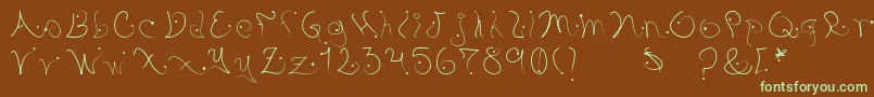 フォントPystil – 緑色の文字が茶色の背景にあります。