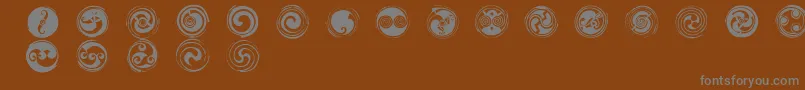 Czcionka SpiralsRegular – szare czcionki na brązowym tle