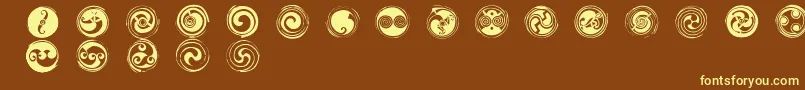 Fonte SpiralsRegular – fontes amarelas em um fundo marrom