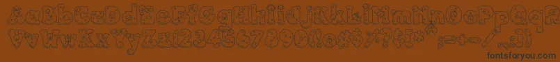 Więcej informacji o czcionce PcSnowballs Czcionka PcSnowballs – czarne czcionki na brązowym tle