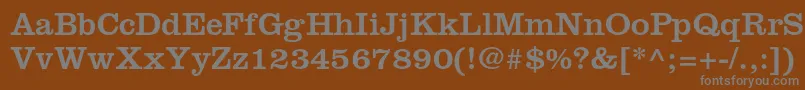 Clarendonltstd-fontti – harmaat kirjasimet ruskealla taustalla