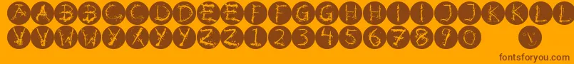 フォントInkalphabetinvers – オレンジの背景に茶色のフォント
