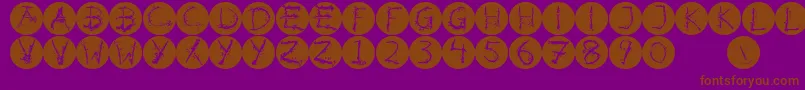 Inkalphabetinvers-fontti – ruskeat fontit violetilla taustalla