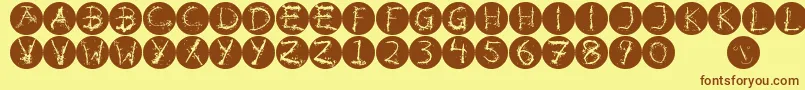 Inkalphabetinvers-fontti – ruskeat fontit keltaisella taustalla
