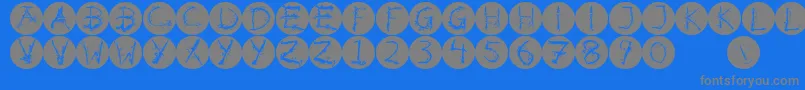 Inkalphabetinvers-fontti – harmaat kirjasimet sinisellä taustalla