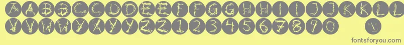Inkalphabetinvers-Schriftart – Graue Schriften auf gelbem Hintergrund