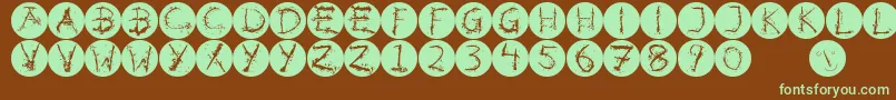 Inkalphabetinvers-fontti – vihreät fontit ruskealla taustalla