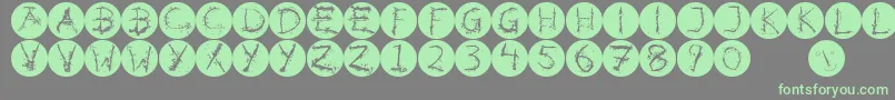 Inkalphabetinvers-Schriftart – Grüne Schriften auf grauem Hintergrund