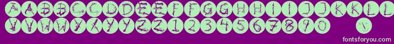 フォントInkalphabetinvers – 紫の背景に緑のフォント