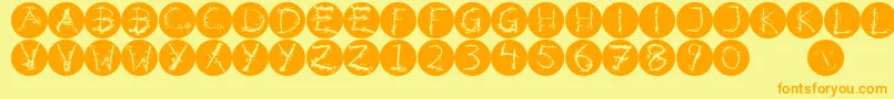 Inkalphabetinvers-fontti – oranssit fontit keltaisella taustalla