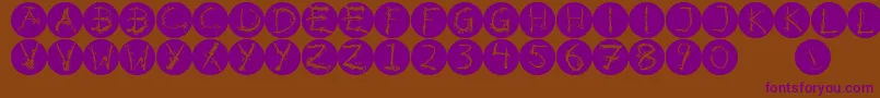 Inkalphabetinvers-fontti – violetit fontit ruskealla taustalla