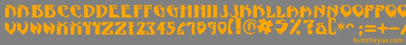 フォントNadcPsygnotic – オレンジの文字は灰色の背景にあります。