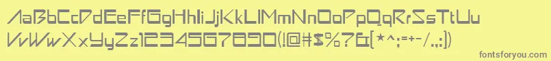 フォントAstron ffy – 黄色の背景に灰色の文字