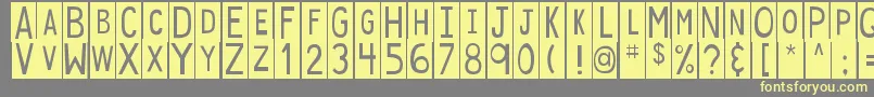 Czcionka DjbStickyTapeLabelsSpaced – żółte czcionki na szarym tle