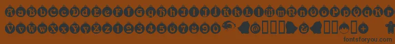 Fonte Christbaumkugeln – fontes pretas em um fundo marrom