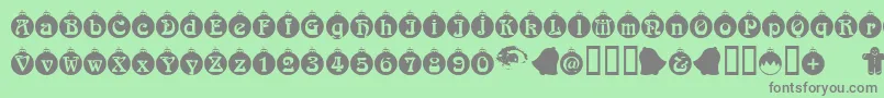 Christbaumkugeln-Schriftart – Graue Schriften auf grünem Hintergrund