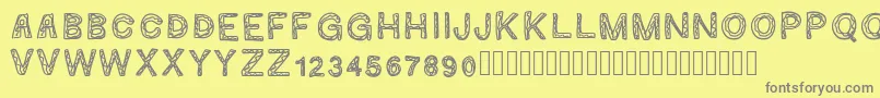Ginumber1-fontti – harmaat kirjasimet keltaisella taustalla