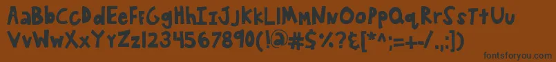 フォントKbwanderaround – 黒い文字が茶色の背景にあります