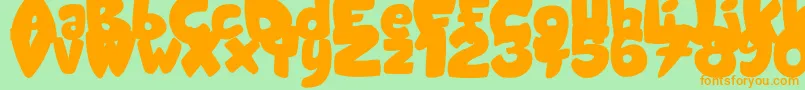 CandyShopBlack-fontti – oranssit fontit vihreällä taustalla