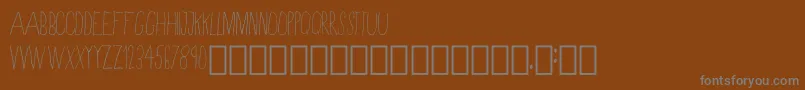 Шрифт SkinnyRegular – серые шрифты на коричневом фоне