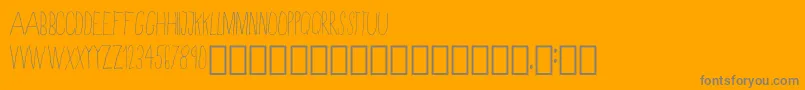 SkinnyRegular-Schriftart – Graue Schriften auf orangefarbenem Hintergrund