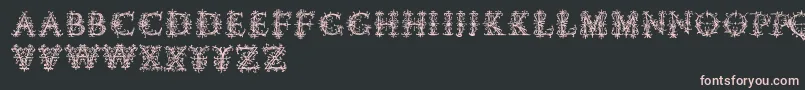 Czcionka Vespasiansflorials – różowe czcionki na czarnym tle