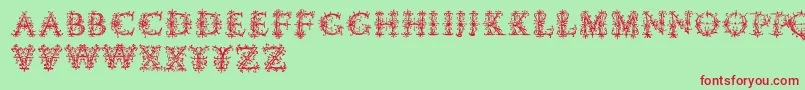 フォントVespasiansflorials – 赤い文字の緑の背景