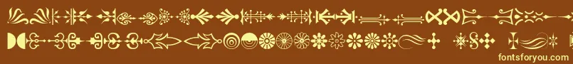 Decorations-fontti – keltaiset fontit ruskealla taustalla