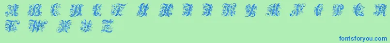 Czcionka Victorianinitials1 – niebieskie czcionki na zielonym tle