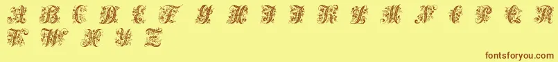 Шрифт Victorianinitials1 – коричневые шрифты на жёлтом фоне