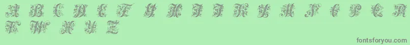 Fonte Victorianinitials1 – fontes cinzas em um fundo verde