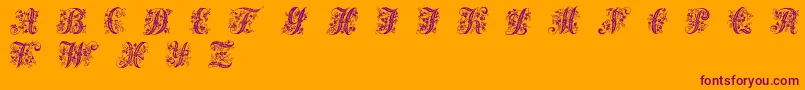 Victorianinitials1-Schriftart – Violette Schriften auf orangefarbenem Hintergrund