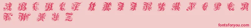 Victorianinitials1-Schriftart – Rote Schriften auf rosa Hintergrund