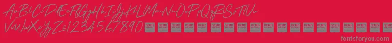 StayRadDemo-Schriftart – Graue Schriften auf rotem Hintergrund